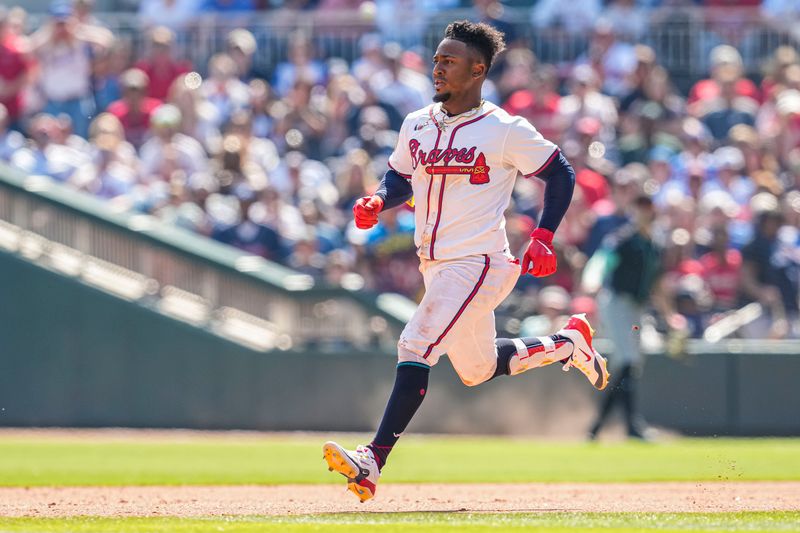 Apr 7, 2024; Cumberland, Georgia, USA; Atlanta Braves second baseman Ozzie Albies (1) runs the bases after hitting a double against the Arizona Diamondbacks during the eighth inning at Truist Park. Mandatory Credit: Dale Zanine-USA TODAY Sports