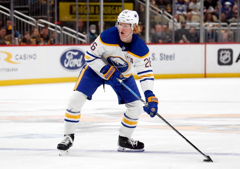 Jan 6, 2024; Pittsburgh, Pennsylvania, USA;  Buffalo Sabres defenseman Rasmus Dahlin (26) handles the puck against the Pittsburgh Penguins during the second period at PPG Paints Arena. Buffalo won 3-1. Mandatory Credit: Charles LeClaire-USA TODAY Sports