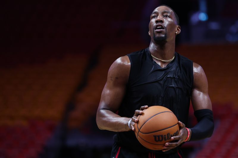 MIAMI, FLORIDA - APRIL 02: Bam Adebayo #13 of the Miami Heat warms up prior to a game against the New York Knicks at Kaseya Center on April 02, 2024 in Miami, Florida. NOTE TO USER: User expressly acknowledges and agrees that, by downloading and or using this photograph, User is consenting to the terms and conditions of the Getty Images License Agreement. (Photo by Megan Briggs/Getty Images)