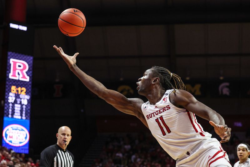 Nov 26, 2022; Piscataway, New Jersey, USA; Rutgers Scarlet Knights center Clifford Omoruyi (11) reaches for a rebound during the first half against the Central Connecticut State Blue Devils at Jersey Mike's Arena. Mandatory Credit: Vincent Carchietta-USA TODAY Sports