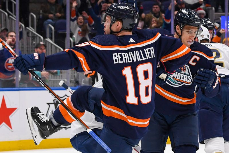 Dec 23, 2022; Elmont, New York, USA;  New York Islanders left wing Anthony Beauvillier (18) celebrates his goal against the Florida Panthers during the second period at UBS Arena. Mandatory Credit: Dennis Schneidler-USA TODAY Sports