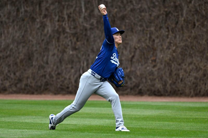 Apr 5, 2024; Chicago, Illinois, USA;  Los Angeles Dodgers pitcher Yoshinobu Yamamoto (18) warms up before the game against the Chicago Cubs at Wrigley Field. Mandatory Credit: Matt Marton-USA TODAY Sports