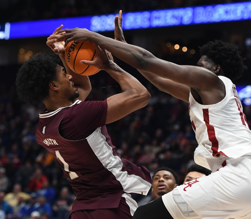 Mar 10, 2023; Nashville, TN, USA; Mississippi State Bulldogs forward Tolu Smith (1) is fouled by Mississippi State Bulldogs forward Tyler Stevenson (14) as he attempts a shot during the second half at Bridgestone Arena. Mandatory Credit: Christopher Hanewinckel-USA TODAY Sports