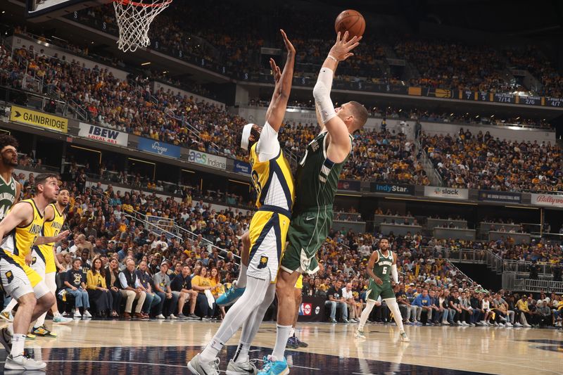 INDIANAPOLIS, IN - APRIL 28: Brook Lopez #11 of the Milwaukee Bucks drives to the basket during the game against the Indiana Pacers during Round 1 Game 4 of the 2024 NBA Playoffs on April 28, 2024 at Gainbridge Fieldhouse in Indianapolis, Indiana. NOTE TO USER: User expressly acknowledges and agrees that, by downloading and or using this Photograph, user is consenting to the terms and conditions of the Getty Images License Agreement. Mandatory Copyright Notice: Copyright 2024 NBAE (Photo by Nathaniel S. Butler/NBAE via Getty Images)