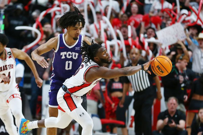 Feb 20, 2024; Lubbock, Texas, USA;  Texas Tech Red Raiders guard Joe Toussaint (6) reaches for the ball in front of TCU Horned Frogs guard Micah Peavy (0) in the second half at United Supermarkets Arena. Mandatory Credit: Michael C. Johnson-USA TODAY Sports