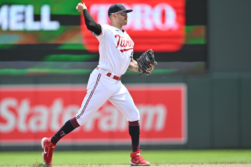 Jun 22, 2023; Minneapolis, Minnesota, USA; Minnesota Twins shortstop Carlos Correa (4) completes a putout during the sixth inning off the bat of Boston Red Sox shortstop David Hamilton (70) at Target Field. Mandatory Credit: Jeffrey Becker-USA TODAY Sports