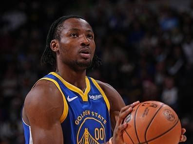 DENVER, CO - DECEMBER 25: Jonathan Kuminga #00 of the Golden State Warriors shoots a free throw during the game against the Denver Nuggets on December 25, 2023 at the Ball Arena in Denver, Colorado. NOTE TO USER: User expressly acknowledges and agrees that, by downloading and/or using this Photograph, user is consenting to the terms and conditions of the Getty Images License Agreement. Mandatory Copyright Notice: Copyright 2023 NBAE (Photo by Bart Young/NBAE via Getty Images)