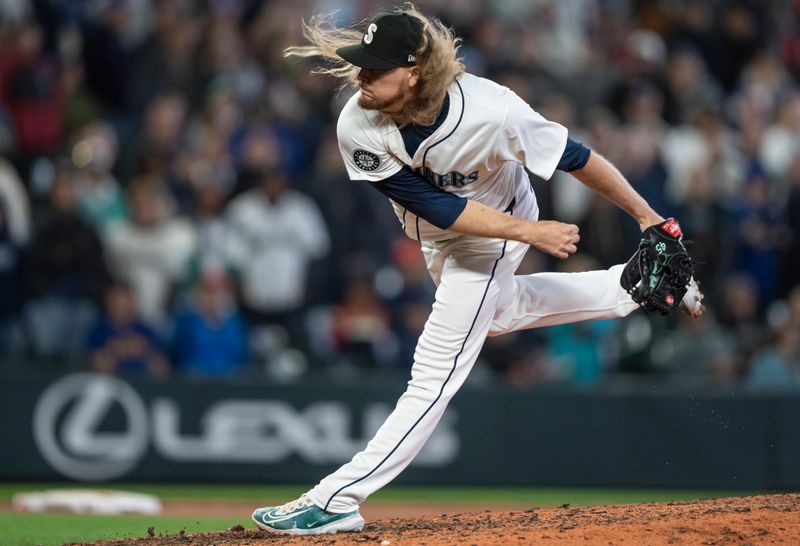 Jun 15, 2024; Seattle, Washington, USA; Seattle Mariners reliever Ryne Stanek (45) delivers a pitch during the ninth inning against the Texas Rangers at T-Mobile Park. Mandatory Credit: Stephen Brashear-USA TODAY Sports