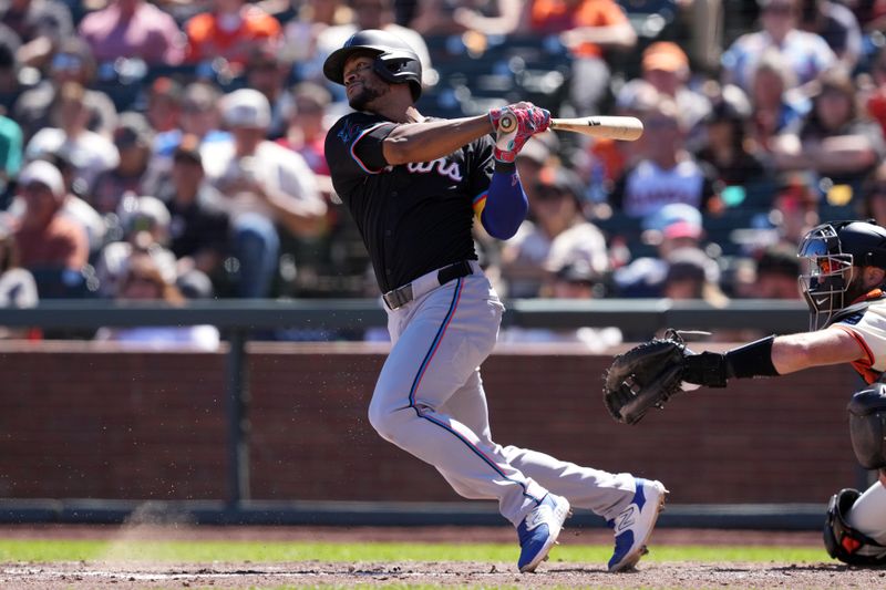 Sep 1, 2024; San Francisco, California, USA; Miami Marlins shortatop Otto Lopez (61) hits an RBI groundout against the San Francisco Giants during the sixth inning at Oracle Park. Mandatory Credit: Darren Yamashita-USA TODAY Sports