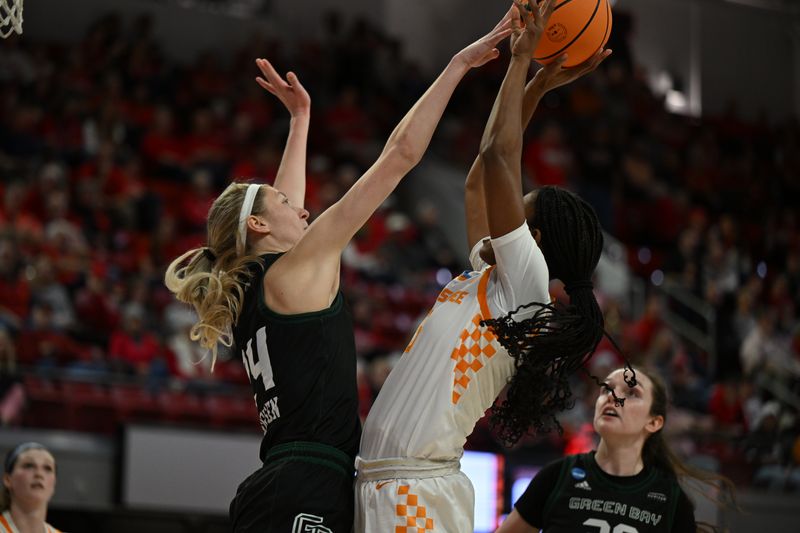 Mar 23, 2024; Raleigh, North Carolina, USA; Tennessee Lady Vols guard Kaiya Wynn (5) shoots over Green Bay Phoenix guard Natalie Andersen (24) in the first round of the 2024 NCAA Women's Tournament at James T. Valvano Arena at William Neal Reynolds. Mandatory Credit: William Howard-USA TODAY Sports