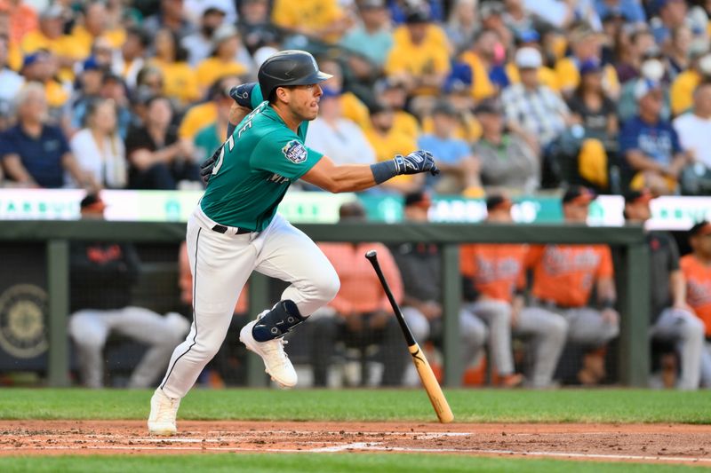 Aug 12, 2023; Seattle, Washington, USA; Seattle Mariners shortstop Dylan Moore (25) hits a double against the Baltimore Orioles during the third inning at T-Mobile Park. Mandatory Credit: Steven Bisig-USA TODAY Sports