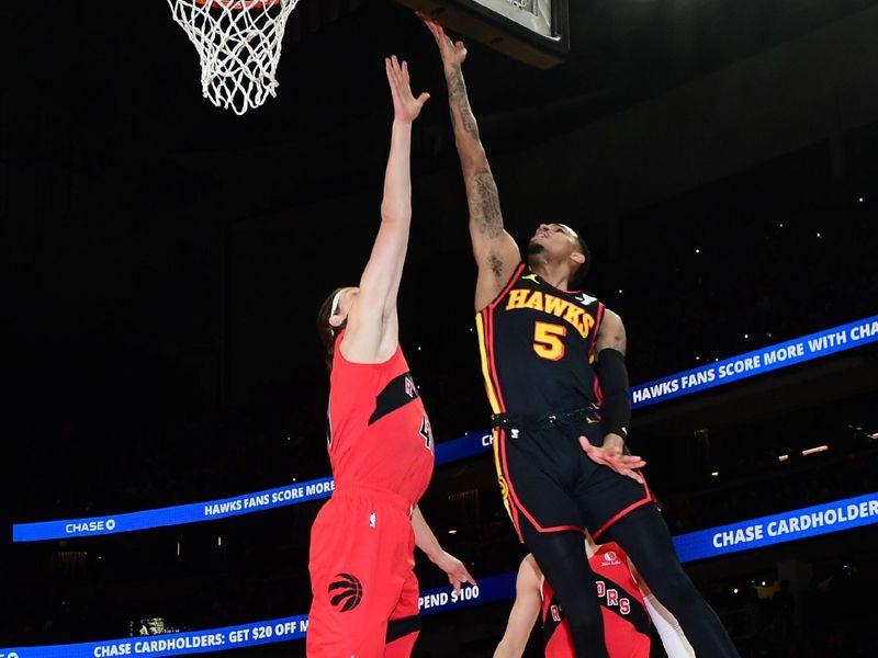 ATLANTA, GA - February 23:  Dejounte Murray #5 of the Atlanta Hawks drives to the basket during the game against the Toronto Raptors on February 23, 2024 at State Farm Arena in Atlanta, Georgia.  NOTE TO USER: User expressly acknowledges and agrees that, by downloading and/or using this Photograph, user is consenting to the terms and conditions of the Getty Images License Agreement. Mandatory Copyright Notice: Copyright 2024 NBAE (Photo by Scott Cunningham/NBAE via Getty Images)