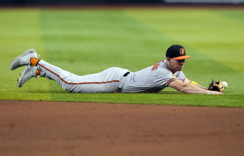 Sep 3, 2023; Phoenix, Arizona, USA; Baltimore Orioles second baseman Jordan Westburg (11) is unable to make a play on a ground ball against the Arizona Diamondbacks during the seventh inning at Chase Field. Mandatory Credit: Joe Camporeale-USA TODAY Sports