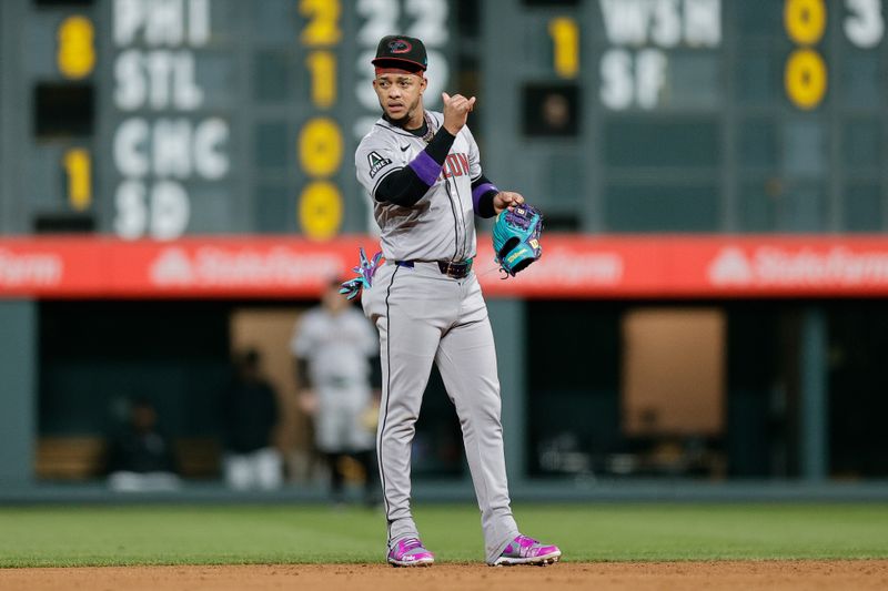 Apr 8, 2024; Denver, Colorado, USA; Arizona Diamondbacks second baseman Ketel Marte (4) gestures in the fourth inning against the Colorado Rockies at Coors Field. Mandatory Credit: Isaiah J. Downing-USA TODAY Sports