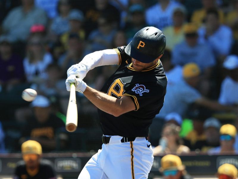 Mar 21, 2026; Bradenton, Florida, USA;  Pittsburgh Pirates second baseman Brandon Lowe (5) singles during the first inning against the Toronto Blue Jays at LECOM Park. Mandatory Credit: Kim Klement Neitzel-Imagn Images