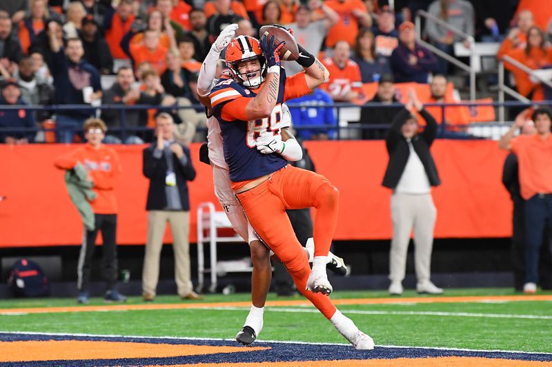 Nov 25, 2023; Syracuse, New York, USA; Syracuse Orange tight end Dan Villari (89) catches the ball for a touchdown as Wake Forest Demon Deacons defensive back Evan Slocum (back) defends during the second half at the JMA Wireless Dome. Mandatory Credit: Rich Barnes-USA TODAY Sports