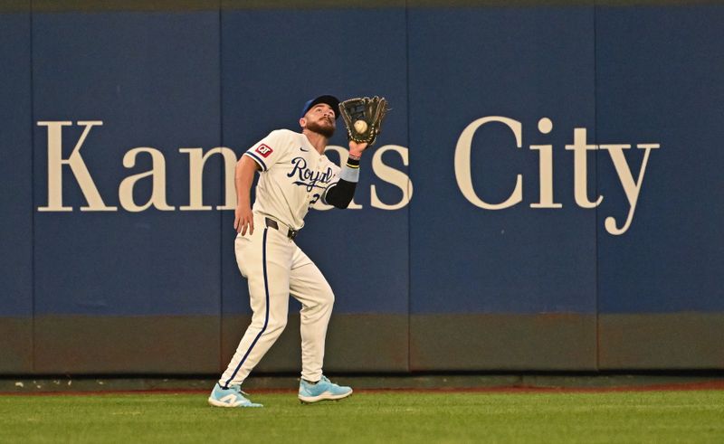 Jul 2, 2024; Kansas City, Missouri, USA;  Kansas City Royals center fielder Kyle Isbel (28) cataches a fly ball in the fourth inning against the Tampa Bay Rays at Kauffman Stadium. Mandatory Credit: Peter Aiken-USA TODAY Sports