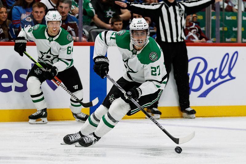 Mar 16, 2025; Denver, Colorado, USA; Dallas Stars left wing Mason Marchment (27) controls the puck in the third period against the Colorado Avalanche at Ball Arena. Mandatory Credit: Isaiah J. Downing-Imagn Images