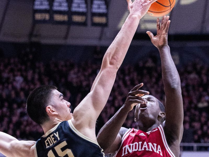 Feb 10, 2024; West Lafayette, Indiana, USA; Indiana Hoosiers forward Payton Sparks (24) shoots the ball while Purdue Boilermakers center Zach Edey (15) defends in the first half at Mackey Arena. Mandatory Credit: Trevor Ruszkowski-USA TODAY Sports