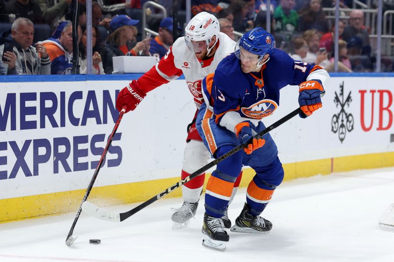 Oct 22, 2024; Elmont, New York, USA; New York Islanders center Mathew Barzal (13) and Detroit Red Wings center Andrew Copp (18) fight for the puck during the second period at UBS Arena. Mandatory Credit: Brad Penner-Imagn Images