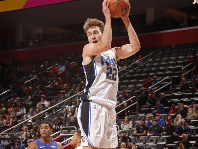 DETROIT, MI - FEBRUARY 4: Franz Wagner #22 of the Orlando Magic rebounds during the game against the Detroit Pistons on February 4, 2024 at Little Caesars Arena in Detroit, Michigan. NOTE TO USER: User expressly acknowledges and agrees that, by downloading and/or using this photograph, User is consenting to the terms and conditions of the Getty Images License Agreement. Mandatory Copyright Notice: Copyright 2024 NBAE (Photo by Brian Sevald/NBAE via Getty Images)