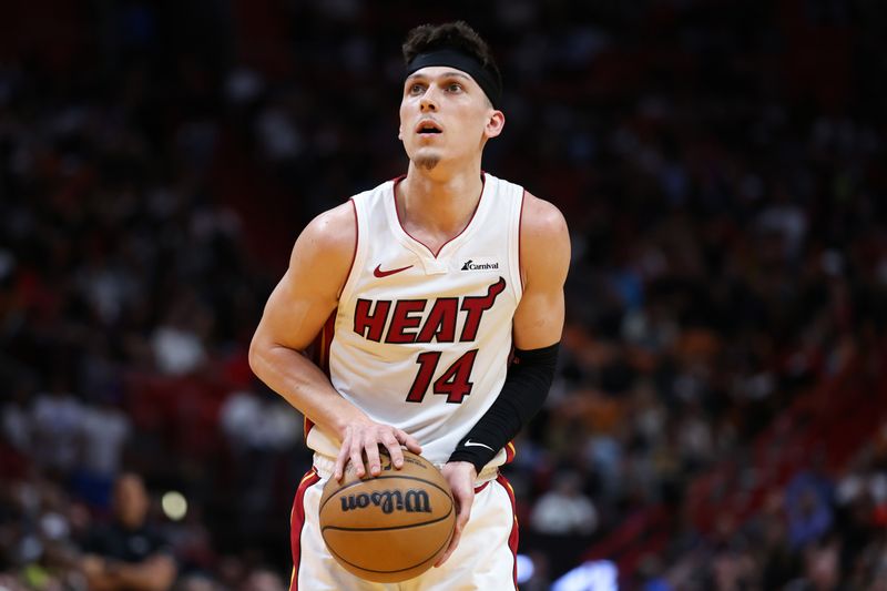 MIAMI, FLORIDA - JANUARY 31: Tyler Herro #14 of the Miami Heat shoots a free throw against the Sacramento Kings during the fourth quarter at Kaseya Center on January 31, 2024 in Miami, Florida. NOTE TO USER: User expressly acknowledges and agrees that, by downloading and or using this photograph, User is consenting to the terms and conditions of the Getty Images License Agreement. (Photo by Megan Briggs/Getty Images)