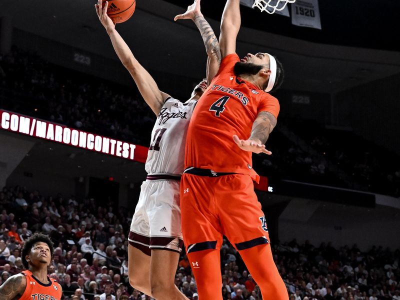 Feb 7, 2023; College Station, Texas, USA; Texas A&M Aggies forward Andersson Garcia (11) shoots the ball while defended by Auburn Tigers forward Johni Broome (4) during the second half at Reed Arena. Mandatory Credit: Maria Lysaker-USA TODAY Sports