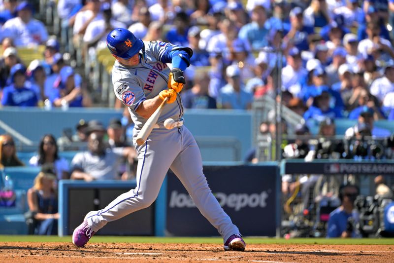 Oct 14, 2024; Los Angeles, California, USA; New York Mets first baseman Pete Alonso (20) hits a single in the third inning against the Los Angeles Dodgers during game two of the NLCS for the 2024 MLB Playoffs at Dodger Stadium. Mandatory Credit: Jayne Kamin-Oncea-Imagn Images