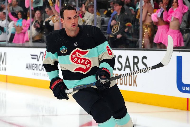 Mar 21, 2024; Las Vegas, Nevada, USA; Seattle Kraken defenseman Brian Dumoulin (8) warms up before a game against the Vegas Golden Knights at T-Mobile Arena. Mandatory Credit: Stephen R. Sylvanie-USA TODAY Sports