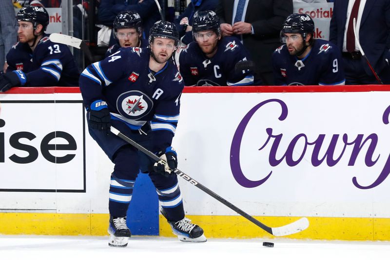 Apr 4, 2024; Winnipeg, Manitoba, CAN; Winnipeg Jets defenseman Josh Morrissey (44) gets set to shoot in the second period against the Calgary Flames at Canada Life Centre. Mandatory Credit: James Carey Lauder-USA TODAY Sports