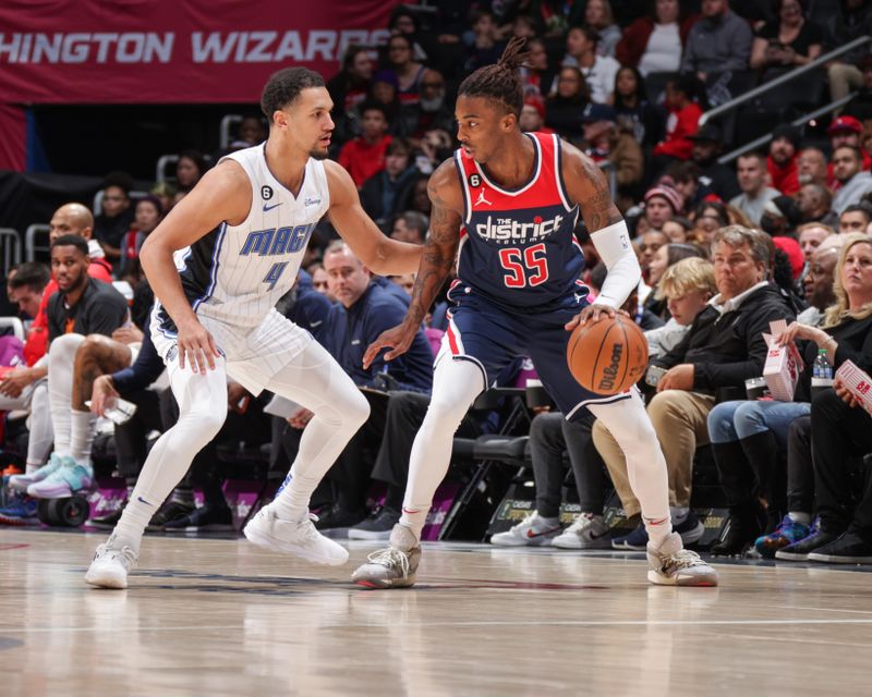 WASHINGTON, DC -? JANUARY 21:  Jalen Suggs #4 of the Orlando Magic plays defense during the game against Delon Wright #55 of the Washington Wizards on January 21, 2023 at Capital One Arena in Washington, DC. NOTE TO USER: User expressly acknowledges and agrees that, by downloading and or using this Photograph, user is consenting to the terms and conditions of the Getty Images License Agreement. Mandatory Copyright Notice: Copyright 2023 NBAE (Photo by KeShawn Ennis /NBAE via Getty Images)