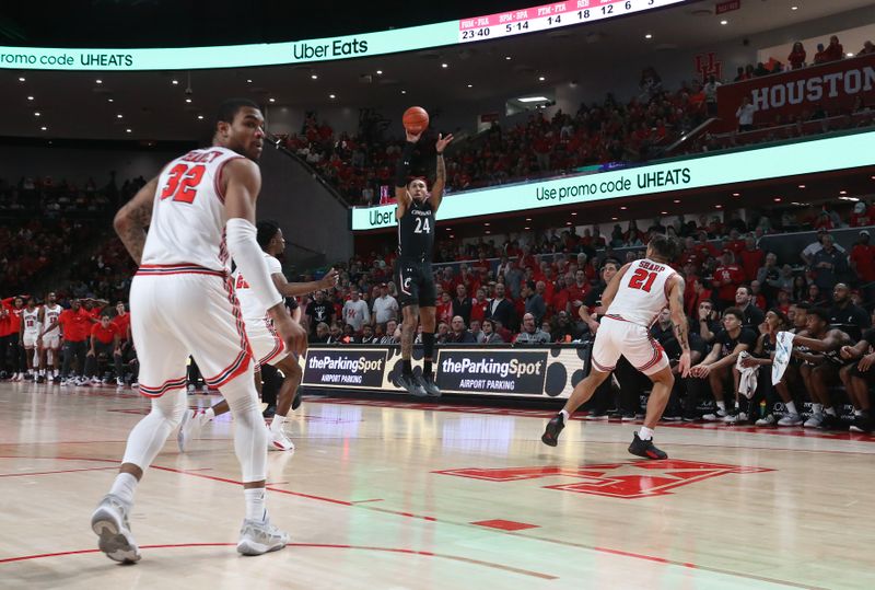 Jan 28, 2023; Houston, Texas, USA; Cincinnati Bearcats guard Jeremiah Davenport (24) makes a three point basket against the Houston Cougars in the second half at Fertitta Center. Houston Cougars won 75 to 69 .Mandatory Credit: Thomas Shea-USA TODAY Sports