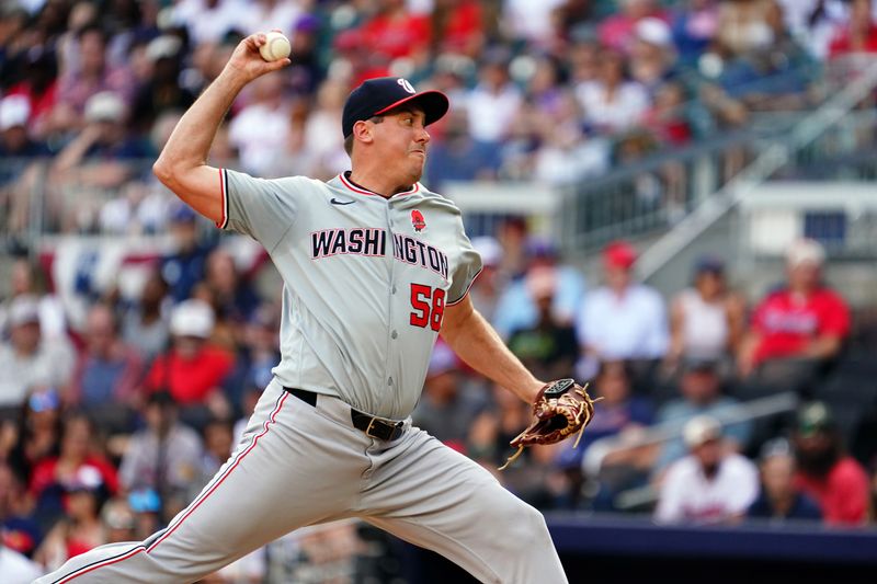 May 27, 2024; Cumberland, Georgia, USA; Washington Nationals pitcher Derek Law (58) pitching against the Atlanta Braves during the seventh inning at Truist Park. Mandatory Credit: John David Mercer-USA TODAY Sports