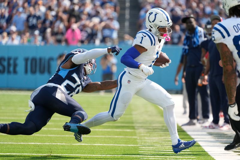 Indianapolis Colts wide receiver Josh Downs (1) makes a first down catch against Tennessee Titans' Quandre Diggs (28) during the second half of an NFL football game, Sunday, Oct. 13, 2024, in Nashville, Tenn. (AP Photo/George Walker IV)