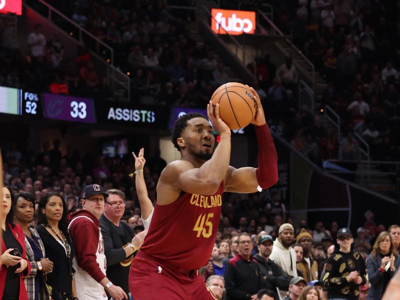 CLEVELAND, OH - FEBRUARY 27: Donovan Mitchell #45 of the Cleveland Cavaliers shoots the ball during the game against the Dallas Mavericks on February 27, 2024 at Rocket Mortgage FieldHouse in Cleveland, Ohio. NOTE TO USER: User expressly acknowledges and agrees that, by downloading and/or using this Photograph, user is consenting to the terms and conditions of the Getty Images License Agreement. Mandatory Copyright Notice: Copyright 2024 NBAE (Photo by  Lauren Leigh Bacho/NBAE via Getty Images)