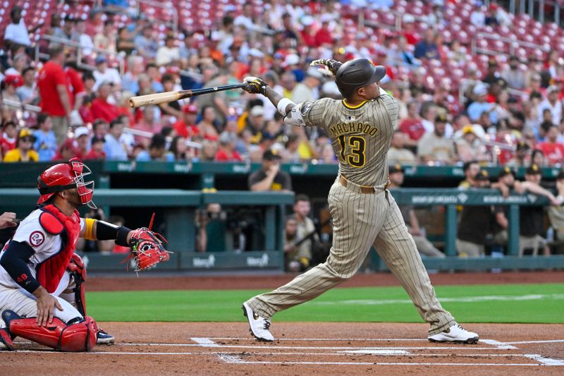 Aug 26, 2024; St. Louis, Missouri, USA;  San Diego Padres third baseman Manny Machado (13) hits a two run home run against the St. Louis Cardinals during the first inning at Busch Stadium. Mandatory Credit: Jeff Curry-USA TODAY Sports