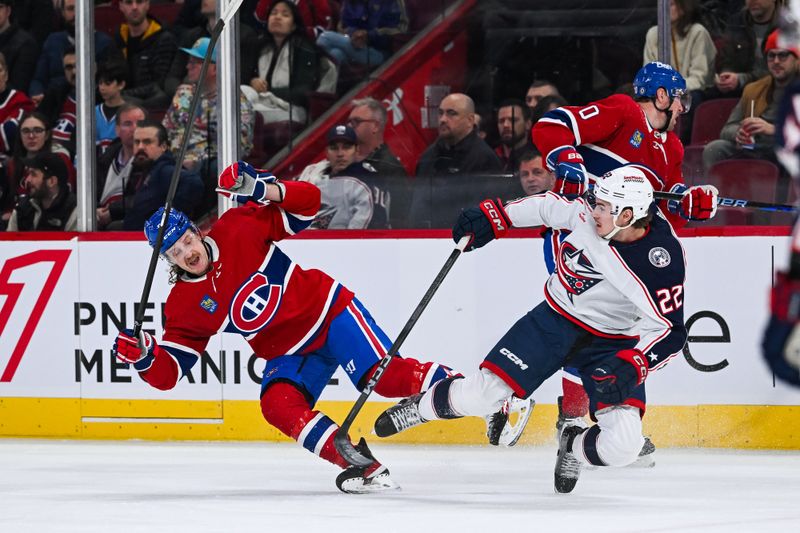 Mar 12, 2024; Montreal, Quebec, CAN; Montreal Canadiens left wing Michael Pezzetta (55) and Columbus Blue Jackets defenseman Jake Bean (22) collide with each other and fall on the ice during the first period at Bell Centre. Mandatory Credit: David Kirouac-USA TODAY Sports