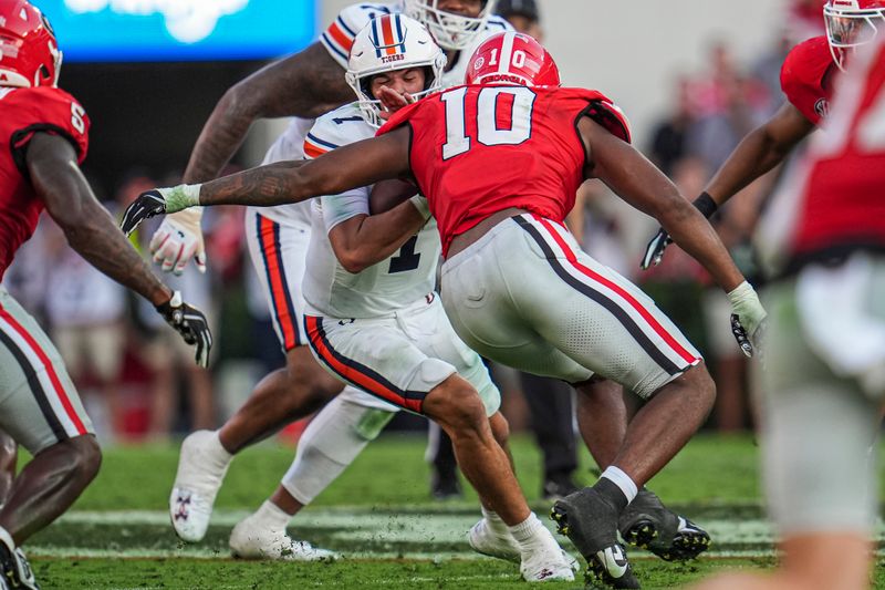 Oct 5, 2024; Athens, Georgia, USA; Georgia Bulldogs linebacker Damon Wilson II (10) tackles Auburn Tigers quarterback Payton Thorne (1) at Sanford Stadium. Mandatory Credit: Dale Zanine-Imagn Images