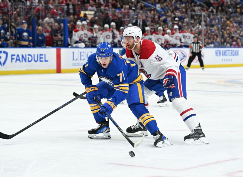 Nov 11, 2024; Buffalo, New York, USA; Buffalo Sabres right wing JJ Peterka (77) controls the puck in front of Montreal Canadiens defenseman Mike Matheson (8) in the second period at KeyBank Center. Mandatory Credit: Mark Konezny-Imagn Images