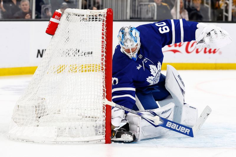 Mar 7, 2024; Boston, Massachusetts, USA; Toronto Maple Leafs goaltender Joseph Woll (60) drops his stick as he pins the puck against the post after it took a strange bounce off the glass during the first period against the Boston Bruins at TD Garden. Mandatory Credit: Winslow Townson-USA TODAY Sports