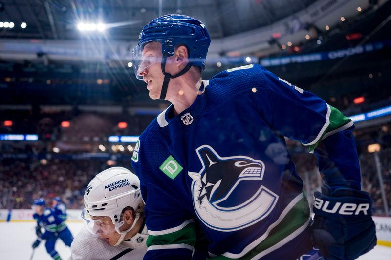 Apr 2, 2023; Vancouver, British Columbia, CAN; Los Angeles Kings forward Blake Lizotte (46) battles with Vancouver Canucks defenseman Tyler Myers (57) in the third period at Rogers Arena. Kings won 4-1. Mandatory Credit: Bob Frid-USA TODAY Sports