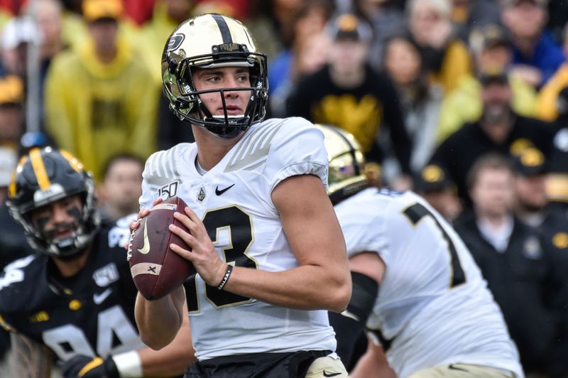 Oct 19, 2019; Iowa City, IA, USA; Purdue Boilermakers quarterback Jack Plummer (13) prepares to throw a pass against the Iowa Hawkeyes during the first quarter at Kinnick Stadium. Mandatory Credit: Jeffrey Becker-USA TODAY Sports