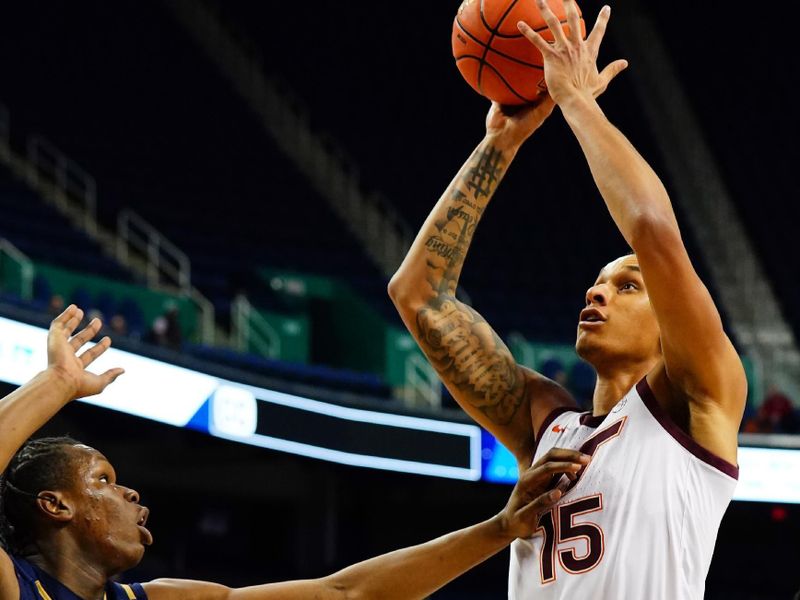 Mar 7, 2023; Greensboro, NC, USA; Virginia Tech Hokies center Lynn Kidd (15)shot against Notre Dame Fighting Irish forward Ven-Allen Lubin (2) during the first half of the first round of the ACC tournament at Greensboro Coliseum. Mandatory Credit: John David Mercer-USA TODAY Sports