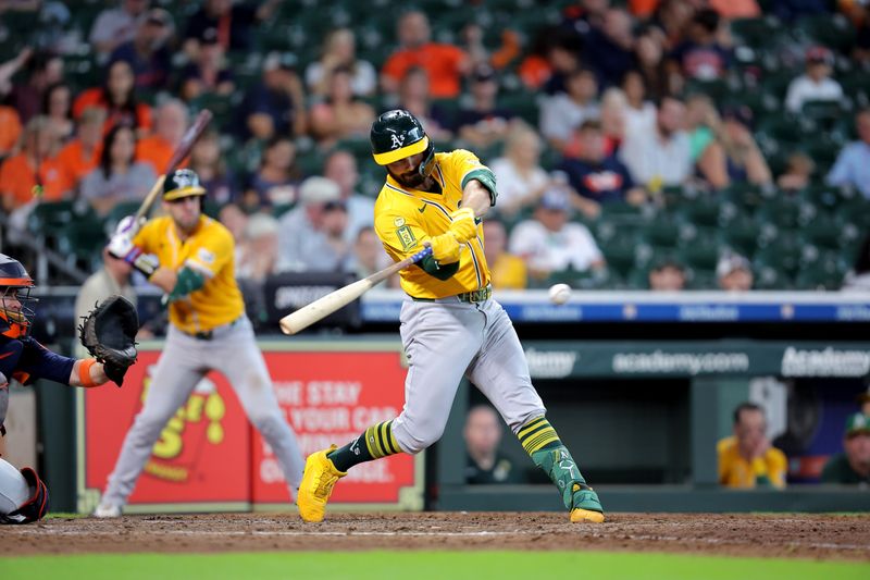Jul 27, 2025; Houston, Texas, USA;  Athletics designated hitter Shea Langeliers (23) hits an infield single against the Houston Astros during the ninth inning at Daikin Park. Mandatory Credit: Erik Williams-Imagn Images