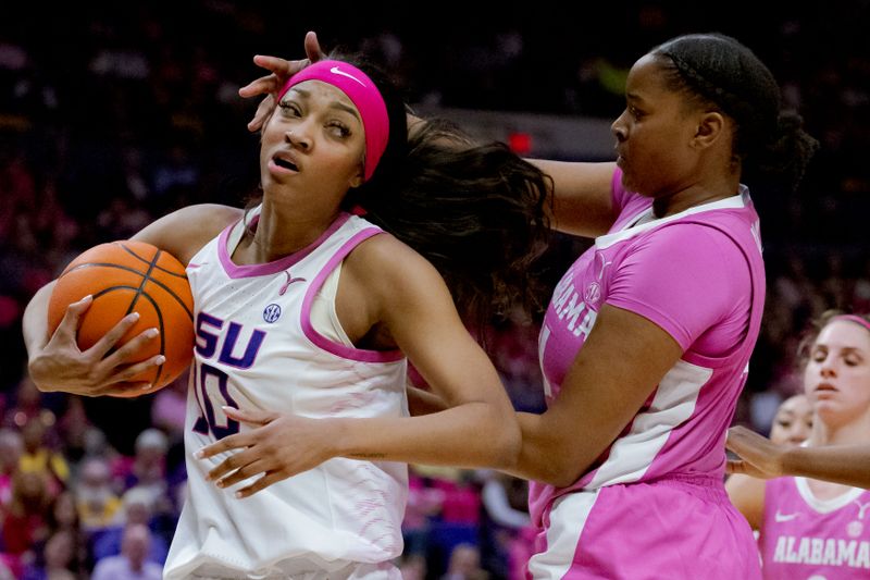 Feb 11, 2024; Baton Rouge, Louisiana, USA;  LSU Lady Tigers forward Angel Reese (10) grabs a rebound from Alabama Crimson Tide forward Essence Cody (21) during the second half at Pete Maravich Assembly Center. Mandatory Credit: Matthew Hinton-USA TODAY Sports