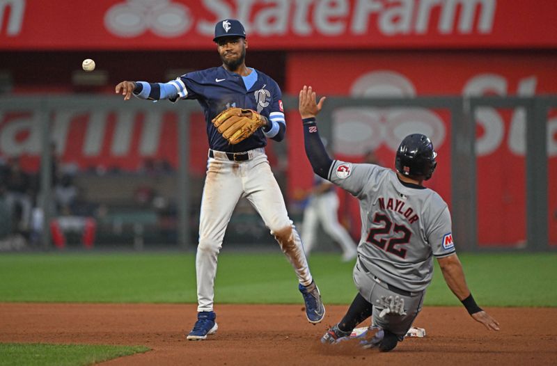 Jun 28, 2024; Kansas City, Missouri, USA;  Kansas City Royals second baseman Maikel Garcia (11) throws to first base for a double play after forcing out Cleveland Guardians Josh Naylor (22) in the third inning at Kauffman Stadium. Mandatory Credit: Peter Aiken-USA TODAY Sports