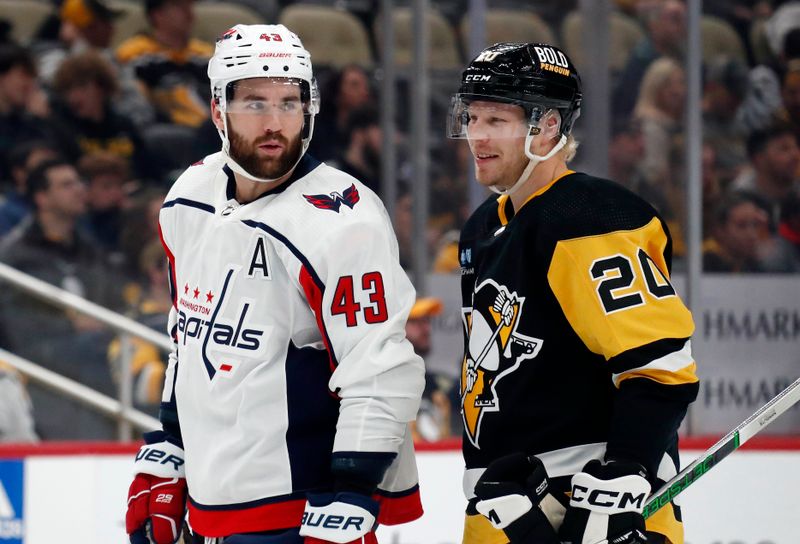 Jan 2, 2024; Pittsburgh, Pennsylvania, USA;  Washington Capitals right wing Tom Wilson (43) and Pittsburgh Penguins center Lars Eller (20) talk on the ice during the second period at PPG Paints Arena. Mandatory Credit: Charles LeClaire-USA TODAY Sports