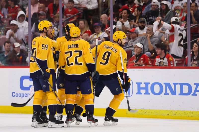 Mar 21, 2024; Sunrise, Florida, USA; Nashville Predators left wing Filip Forsberg (9) celebrates with teammates after scoring against the Florida Panthers during the second period at Amerant Bank Arena. Mandatory Credit: Sam Navarro-USA TODAY Sports