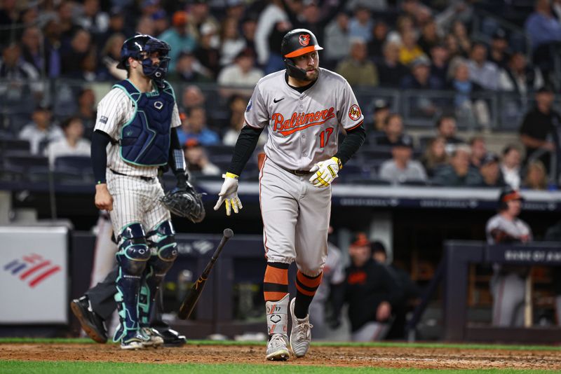 Sep 24, 2024; Bronx, New York, USA; Baltimore Orioles left fielder Colton Cowser (17) hits a solo home run during the eighth inning against the New York Yankees at Yankee Stadium. Mandatory Credit: Vincent Carchietta-Imagn Images
