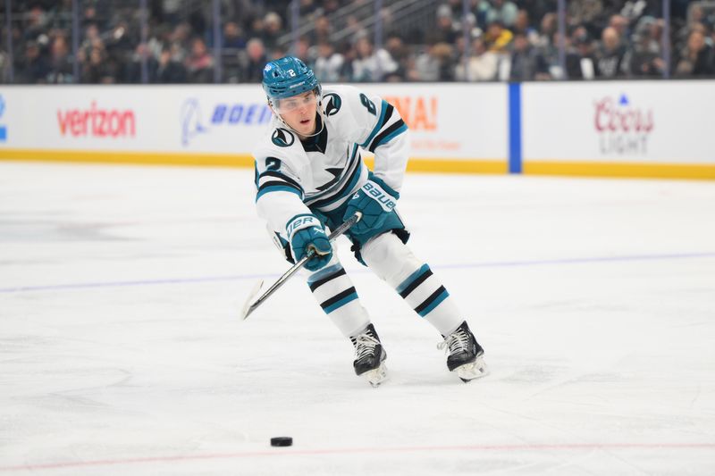 Nov 30, 2024; Seattle, Washington, USA; San Jose Sharks center Will Smith (2) plays the puck during the first period against the Seattle Kraken at Climate Pledge Arena. Mandatory Credit: Steven Bisig-Imagn Images